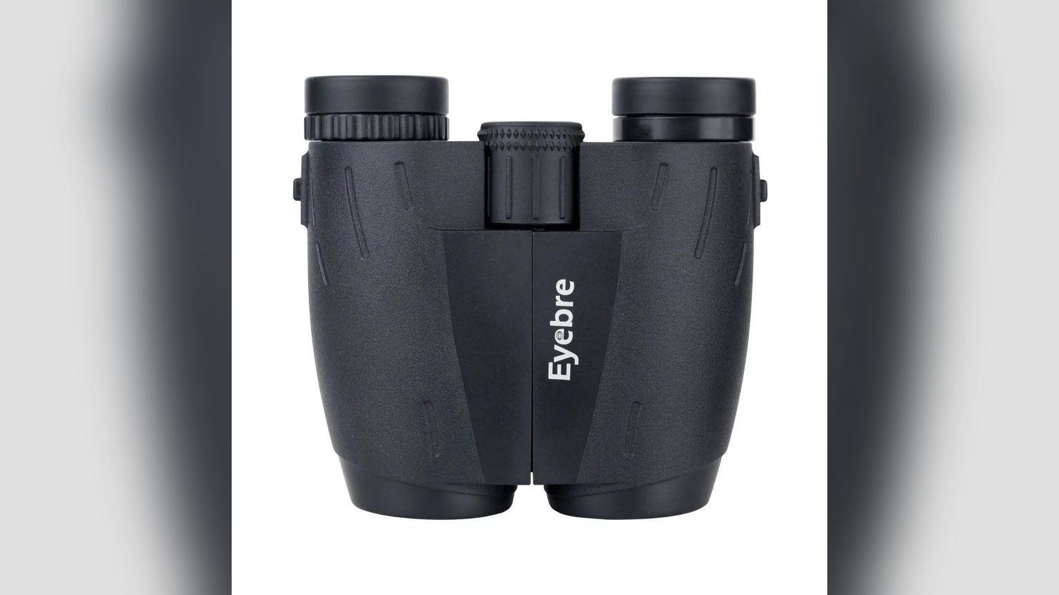Binocular compacto negro 10x25 con lentes frontales visibles, estuche de transporte sobre mesa de madera